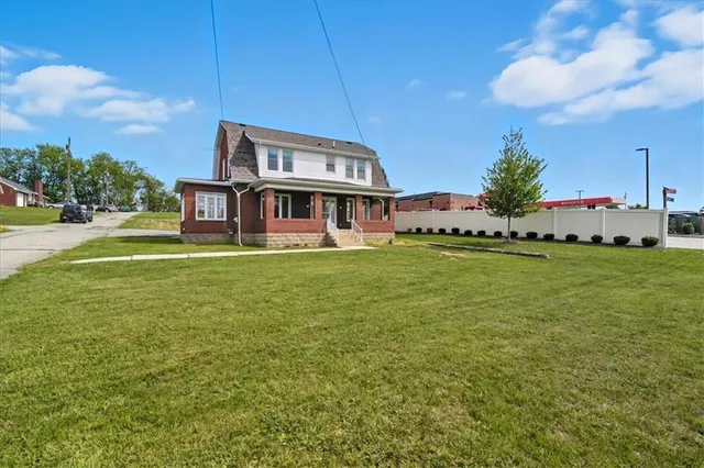 a view of a house with a big yard