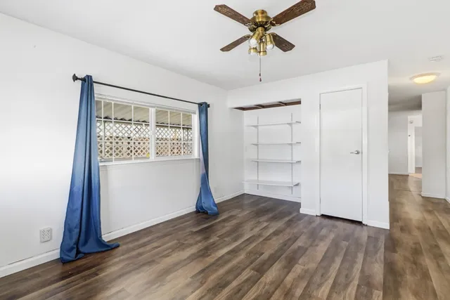 a view of a swimming pool with outdoor seating and plants