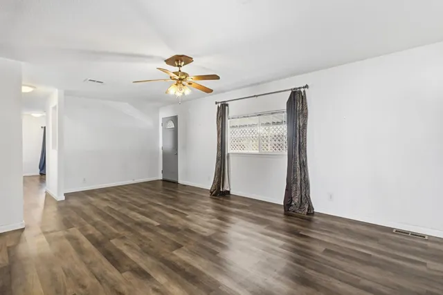 a kitchen with stainless steel appliances a refrigerator and a stove top oven