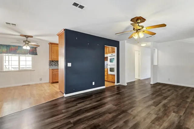 a bathroom with a granite countertop sink and a bathtub