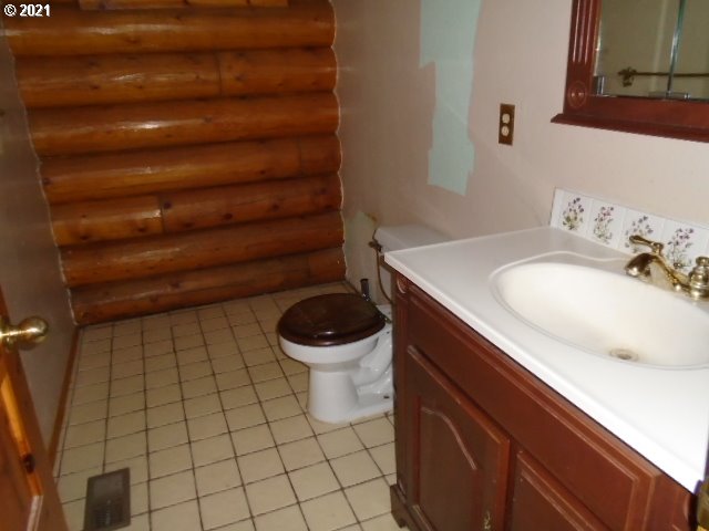 12125 Southeast Laughing Water Road Sandy, OR 97055 - Photo 13 of 24 a bathroom with a sink and a toilet