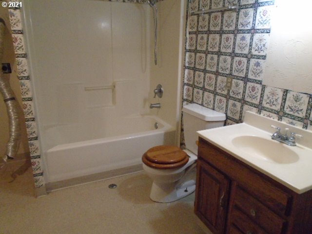 12125 Southeast Laughing Water Road Sandy, OR 97055 - Photo 17 of 24 a bathroom with a sink a toilet and shower