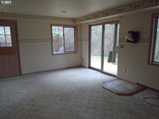 12125 Southeast Laughing Water Road Sandy, OR 97055 - Photo 18 of 24 an empty room with windows