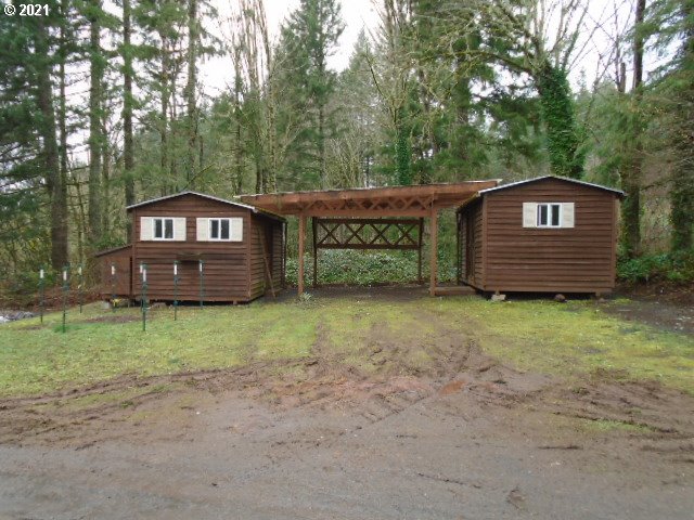 12125 Southeast Laughing Water Road Sandy, OR 97055 - Photo 23 of 24 a front view of a house with a garden