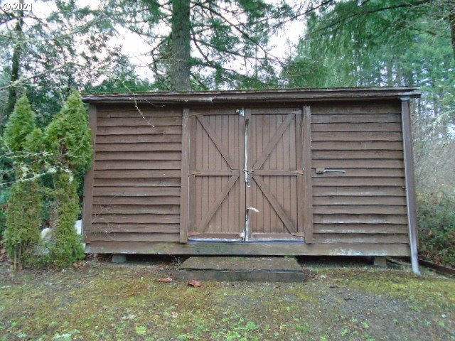 12125 Southeast Laughing Water Road Sandy, OR 97055 - Photo 24 of 24 a side view of a house with a yard