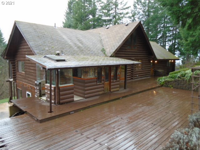 12125 Southeast Laughing Water Road Sandy, OR 97055 - Photo 4 of 24 a view of a house with wooden fence