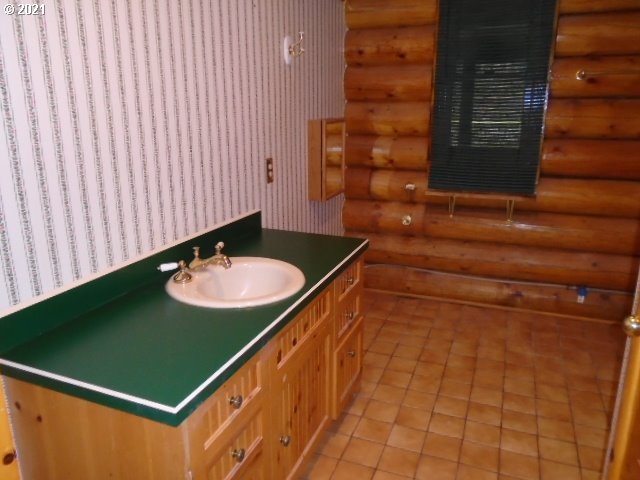 12125 Southeast Laughing Water Road Sandy, OR 97055 - Photo 10 of 24 a bathroom with a sink and a mirror