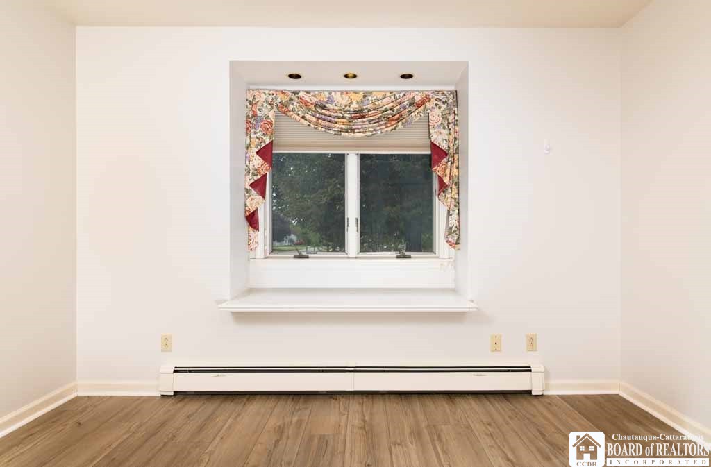 11 Pleasant Avenue Pomfret, NY 14063 - Photo 13 of 45 Front bedroom with storage compartment beneath win