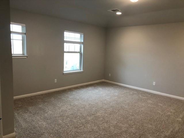 137 Peruvian Lane Georgetown, TX 78626 - Photo 4 of 12 an empty room with windows