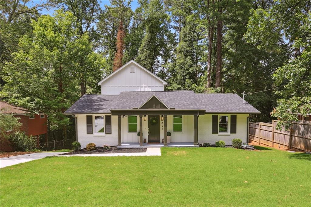 821 Larry Lane Decatur, GA 30033 - Photo 1 of 1 a front view of a house with a garden