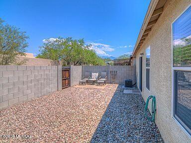 3248 West Treece Place Tucson, AZ 85742 - Photo 14 of 17 a view of a backyard with sitting area