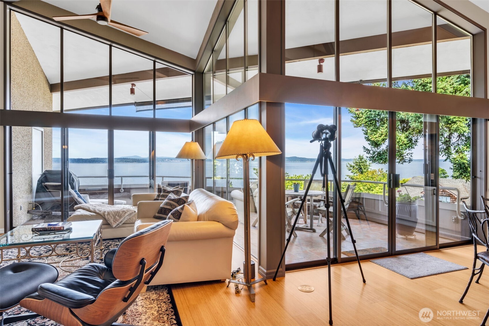 7019 47th Avenue Southwest, Unit 18 Seattle, WA 98136 - Photo 16 of 39 a dining room with furniture water view and wooden floor