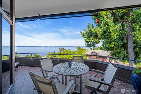 a dining room with furniture and outdoor view