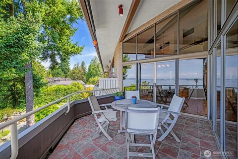 a view of a chairs and table in patio