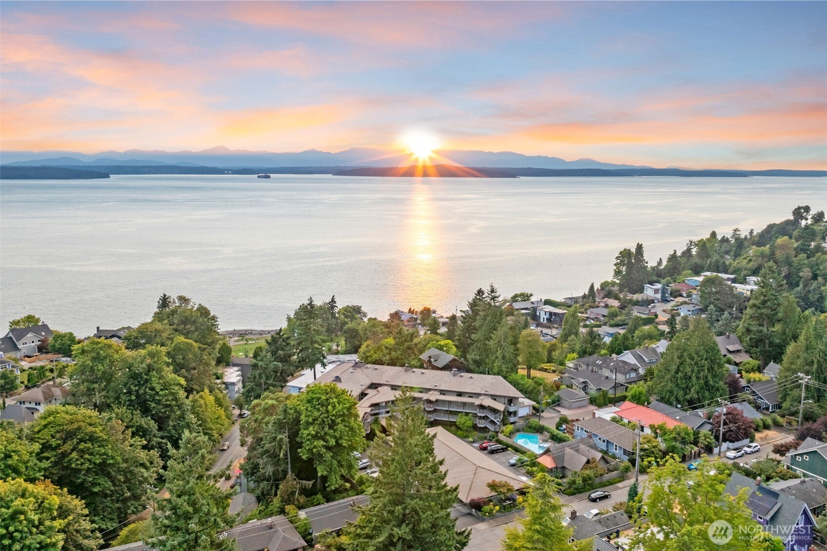 7019 47th Avenue Southwest, Unit 18 Seattle, WA 98136 - Photo 31 of 39 a view of a lake and mountain