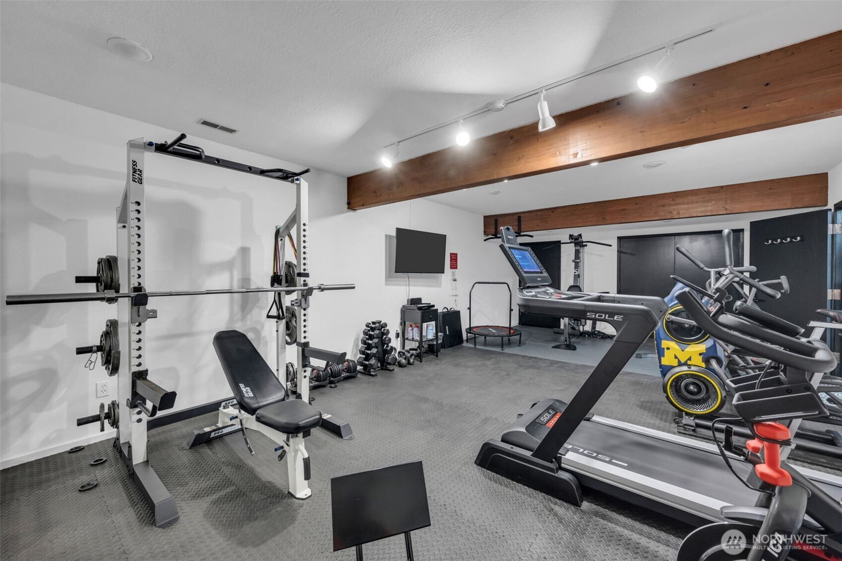 7019 47th Avenue Southwest, Unit 18 Seattle, WA 98136 - Photo 37 of 39 a view of a room with gym equipment