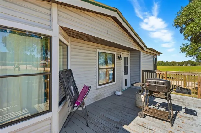 a view of deck with wooden floor and seating space