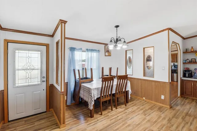 a view of a room with furniture and wooden floor