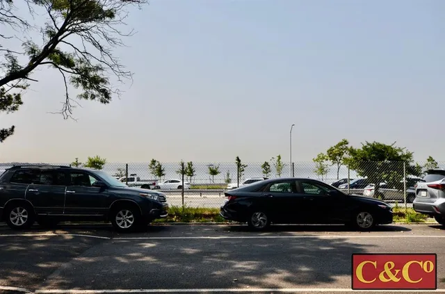 a view of cars parked in front of a house