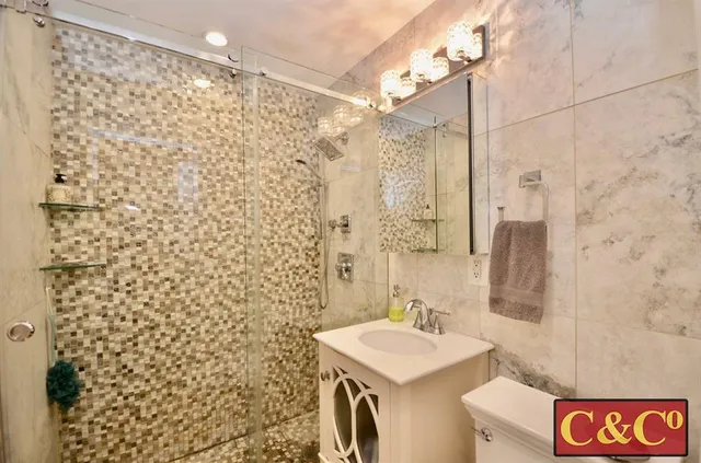 a bathroom with a sink and a shower