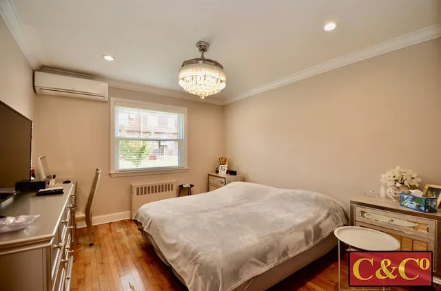 a bed room with a bed and a tv