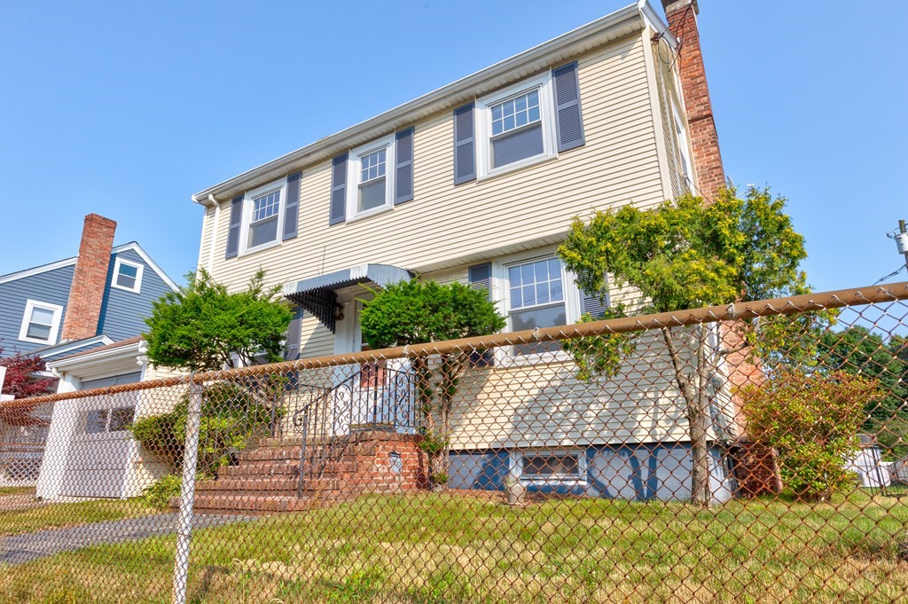 a view of house with outdoor space and sitting area