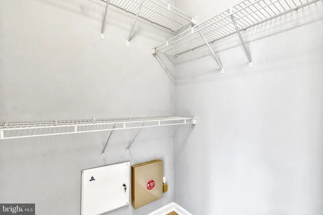 a view of storage and utility room with racks on the wall