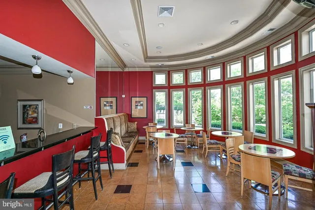 a very nice looking living room with furniture and floor to ceiling windows