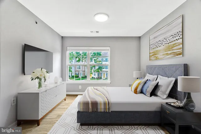 a bedroom with a bed and a couch