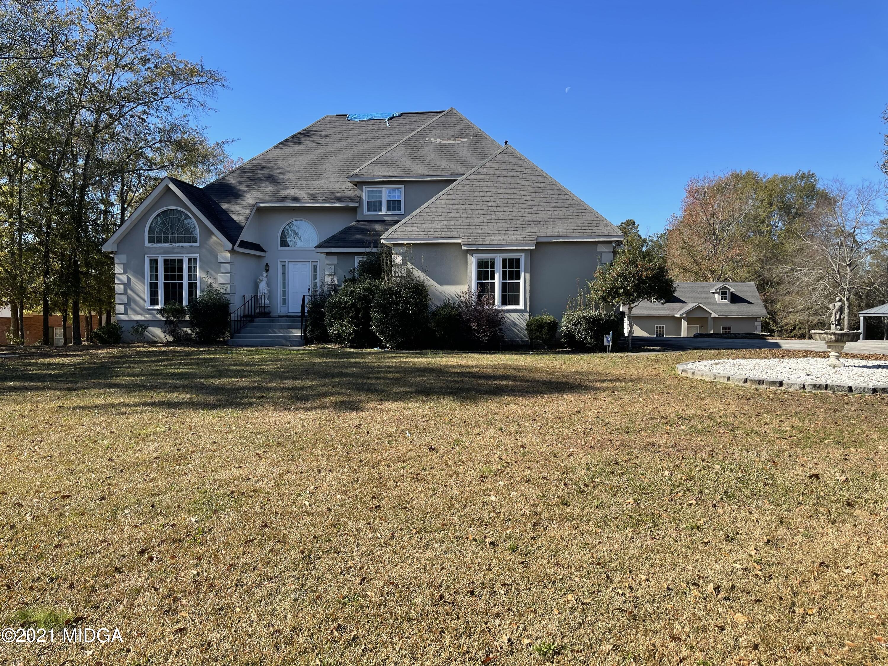 129 Gates Road Lizella, GA 31052 - Photo 1 of 4 a front view of a house with a yard