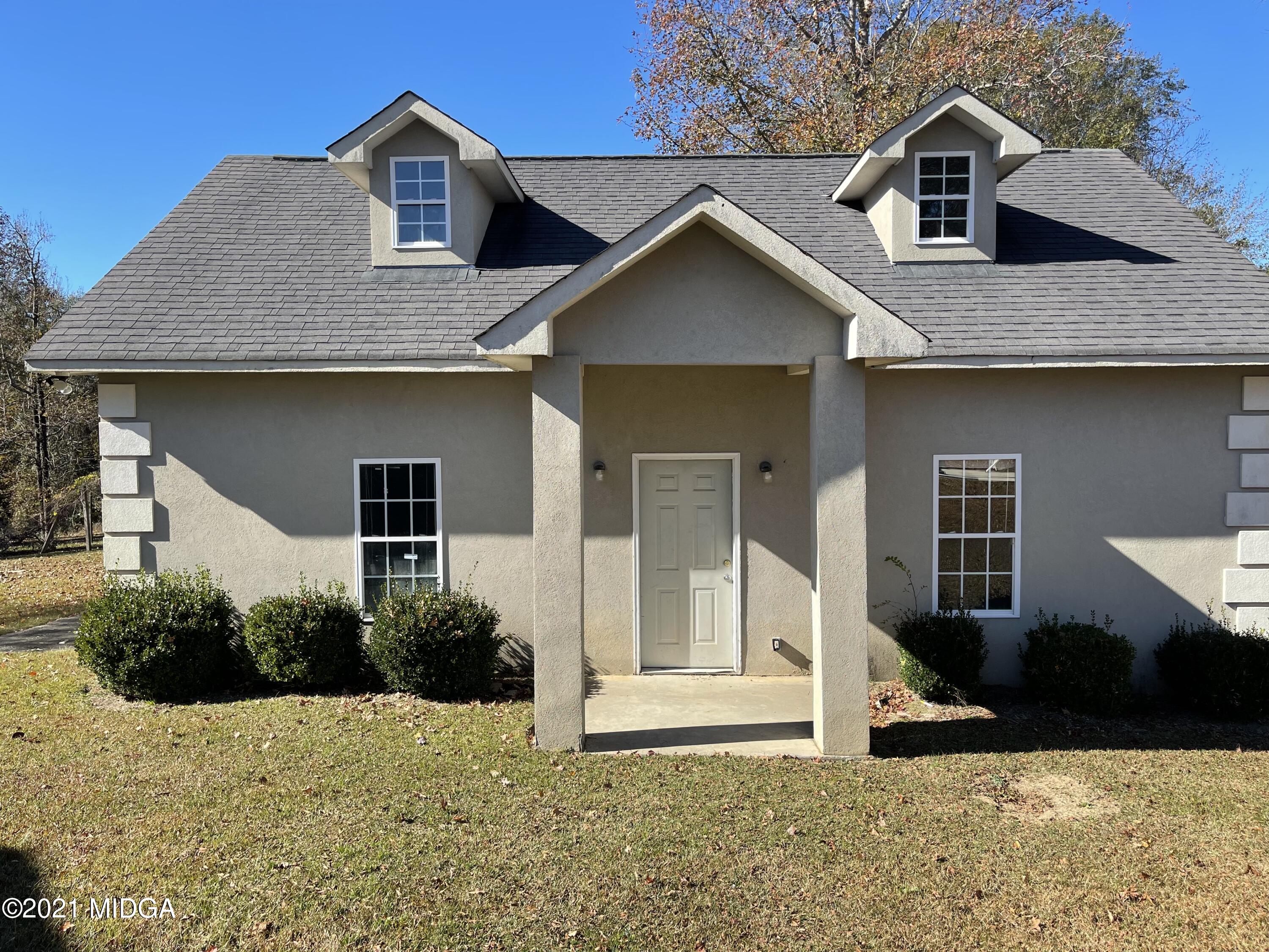 129 Gates Road Lizella, GA 31052 - Photo 3 of 4 a front view of a house with a yard