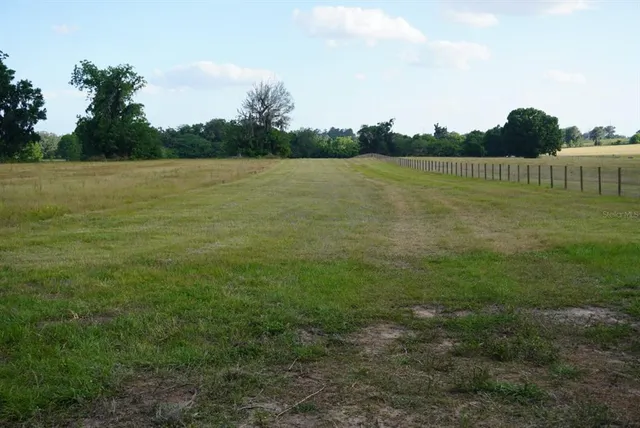 a view of a lake with houses in background