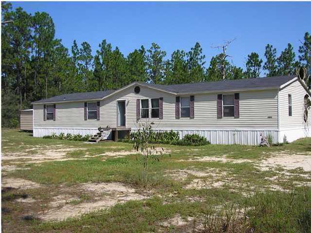 4493 Rainbird Rise Road Crestview, FL 32539 - Photo 1 of 27 a view of a house with a yard