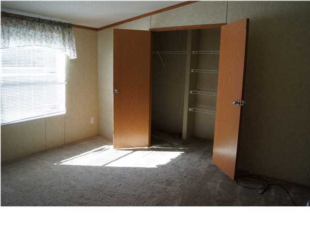 4493 Rainbird Rise Road Crestview, FL 32539 - Photo 12 of 27 a room with window and closet