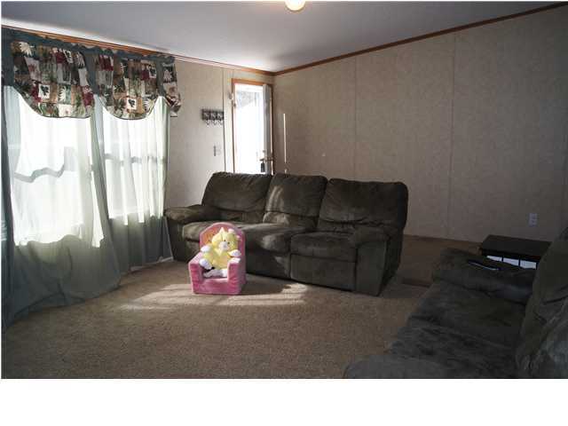4493 Rainbird Rise Road Crestview, FL 32539 - Photo 2 of 27 a living room with furniture window and wooden floor