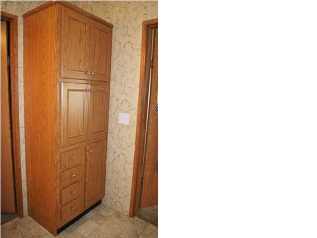 4493 Rainbird Rise Road Crestview, FL 32539 - Photo 21 of 27 a view of cabinet and mirror