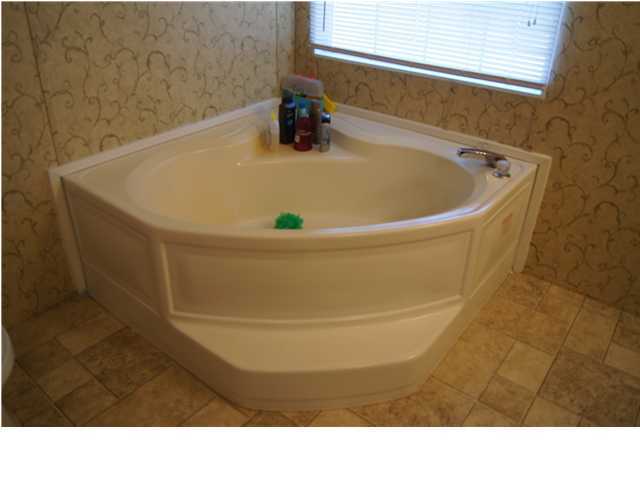 4493 Rainbird Rise Road Crestview, FL 32539 - Photo 22 of 27 a bathroom with a sink