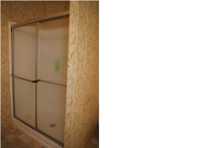 4493 Rainbird Rise Road Crestview, FL 32539 - Photo 23 of 27 a picture of a bathroom with a shower