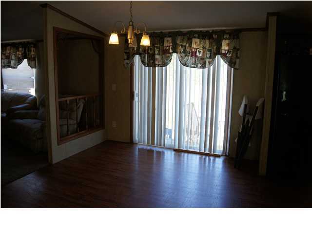 4493 Rainbird Rise Road Crestview, FL 32539 - Photo 4 of 27 a black and white wall with glass windows
