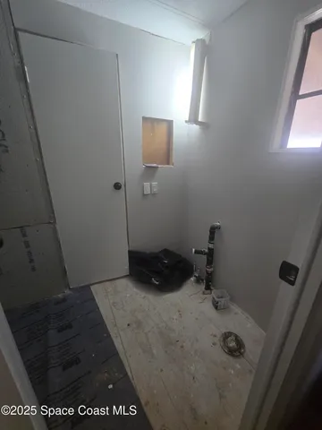 a bed room with a bed and a window