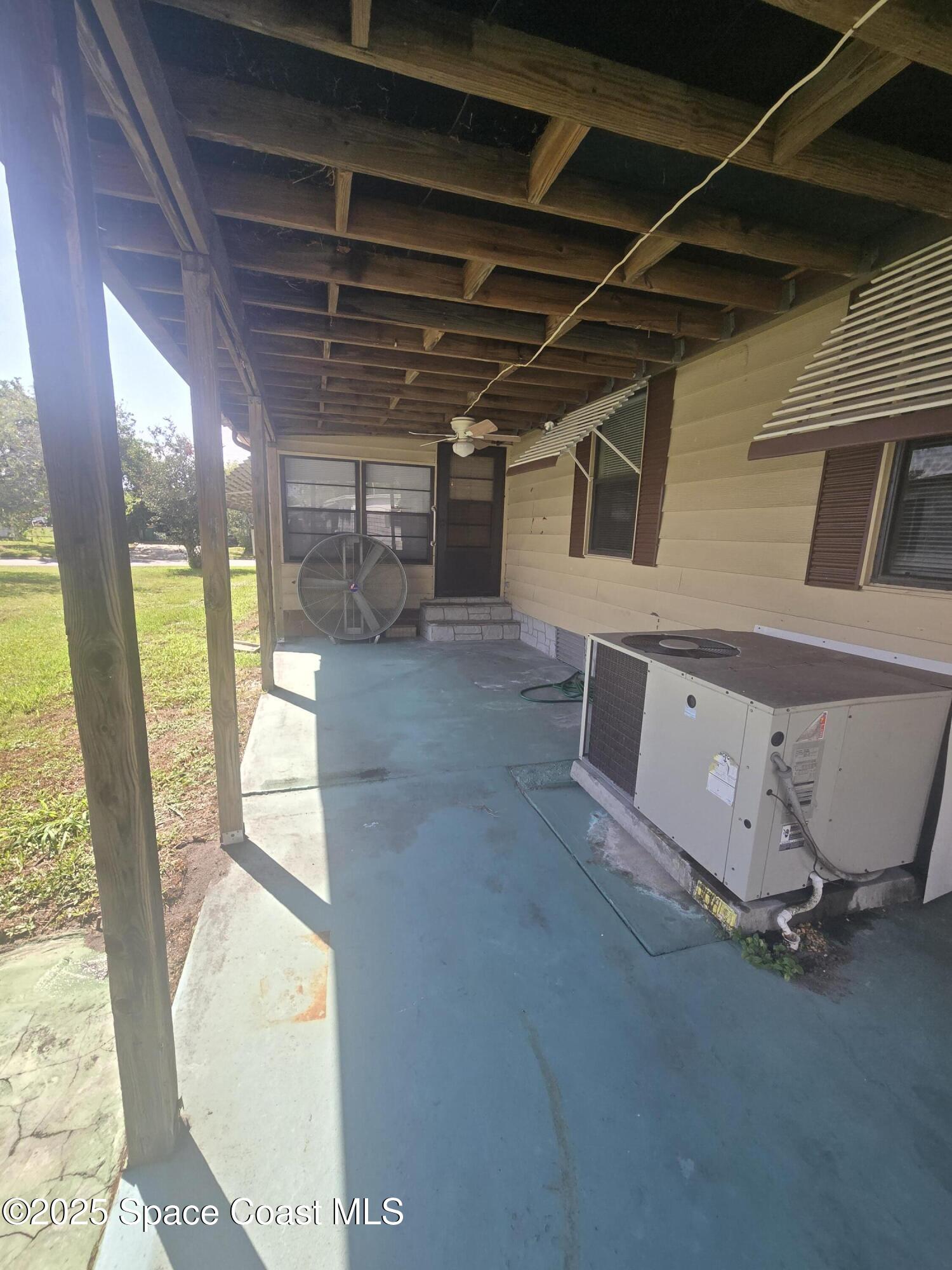 623 Marlin Circle Barefoot Bay, FL 32976 - Photo 18 of 20 a view of a storage & utility room