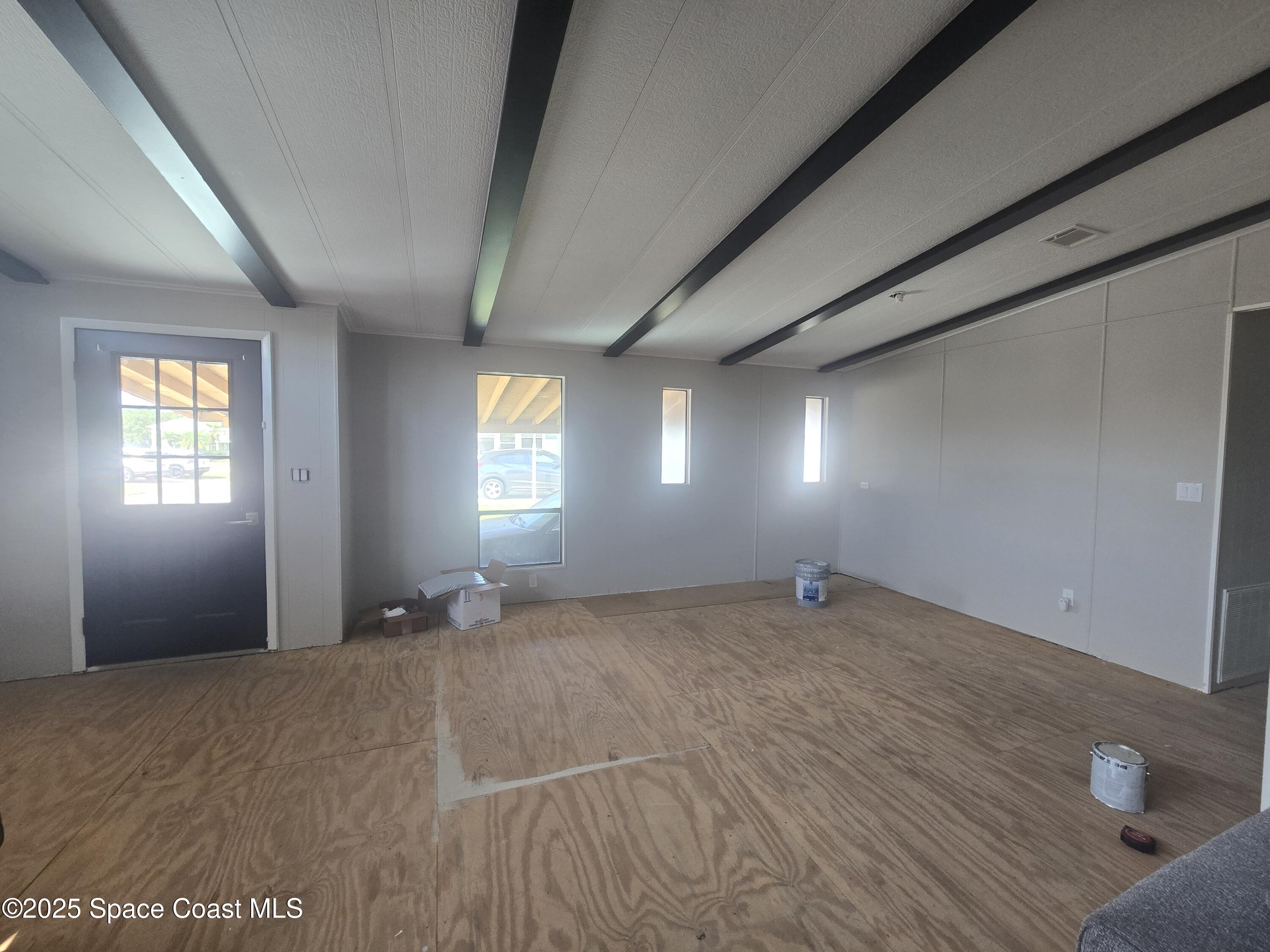 623 Marlin Circle Barefoot Bay, FL 32976 - Photo 5 of 20 a view of empty room with window