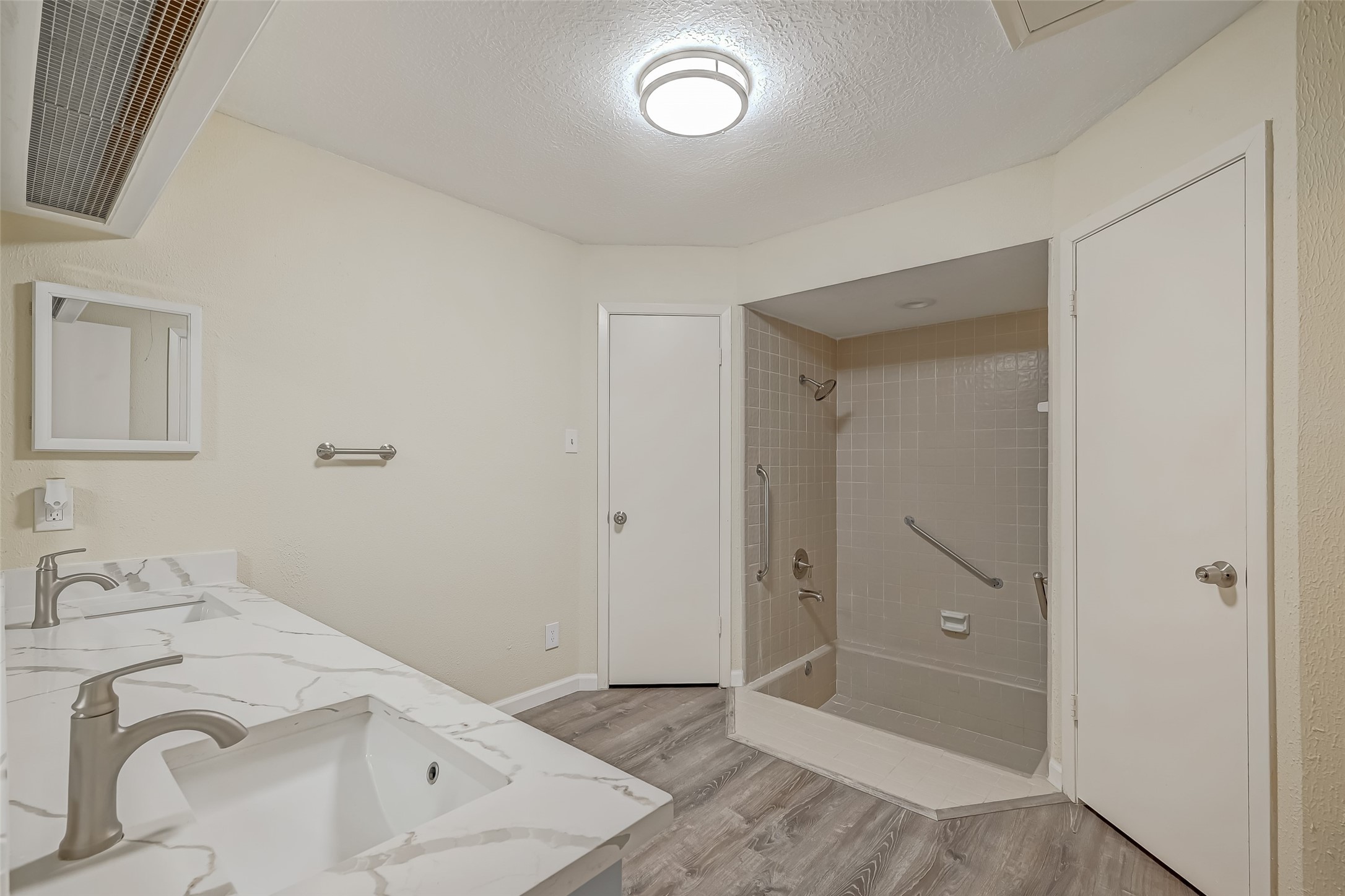 2107 Shadowbriar Drive Houston, TX 77077 - Photo 12 of 23 a bathroom with a sink and a shower
