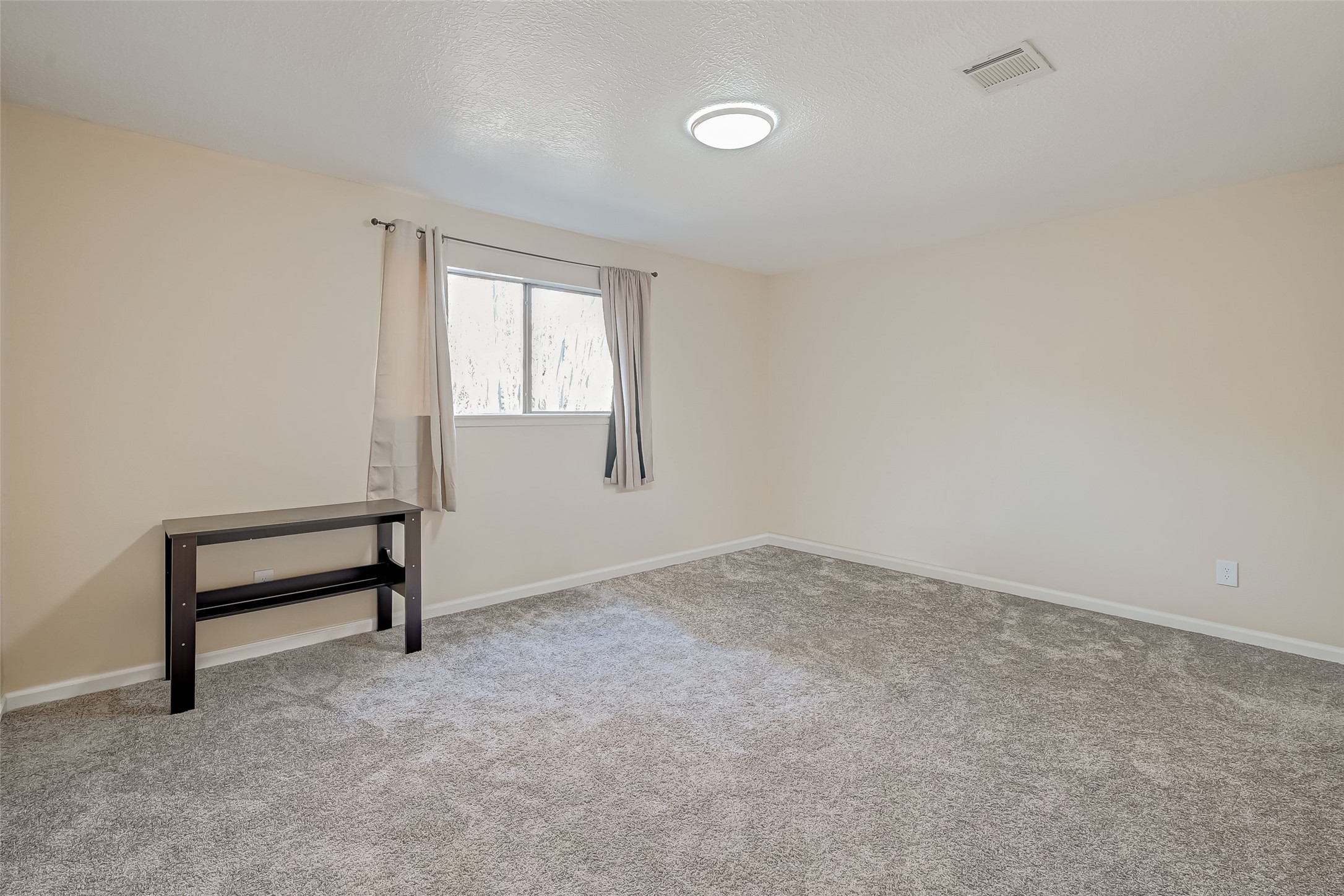 2107 Shadowbriar Drive Houston, TX 77077 - Photo 16 of 23 a view of an empty room with a window