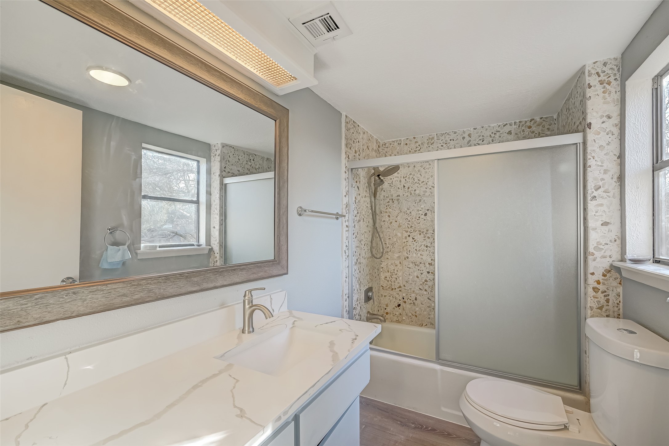 2107 Shadowbriar Drive Houston, TX 77077 - Photo 17 of 23 a bathroom with a sink toilet and shower