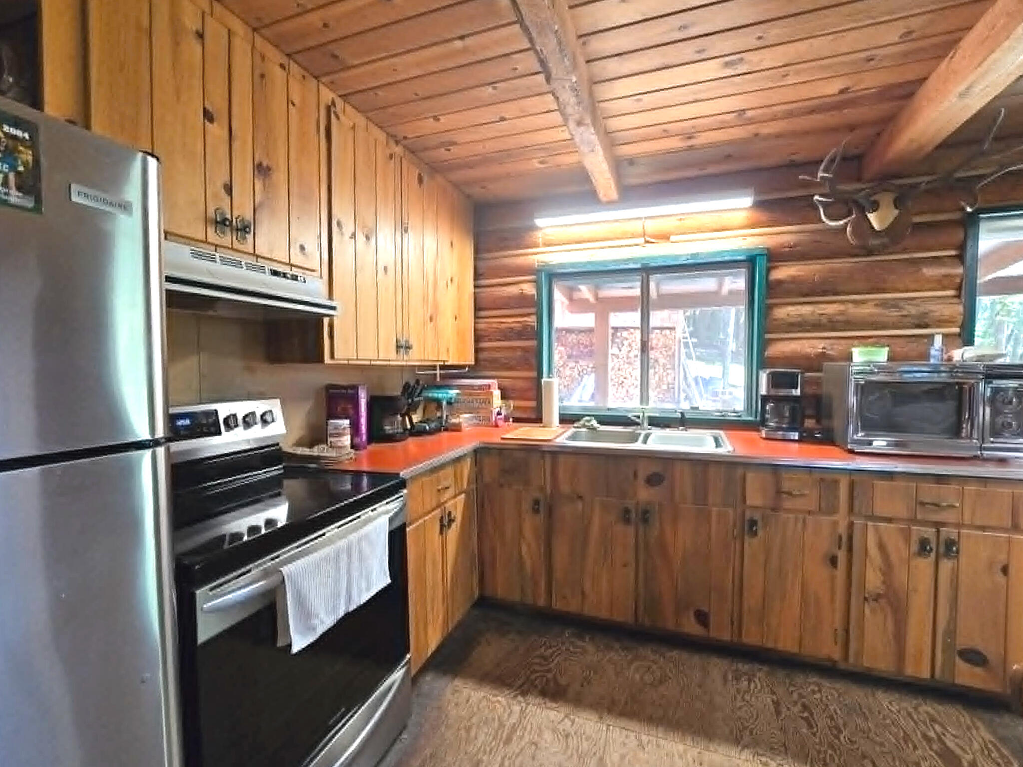 836 Ulrich Road Prospect, OR 97536 - Photo 16 of 47 a kitchen with stainless steel appliances a sink a stove and a refrigerator