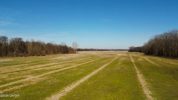 a view of a lake with a yard