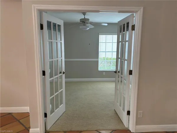 a view of an empty room with a window