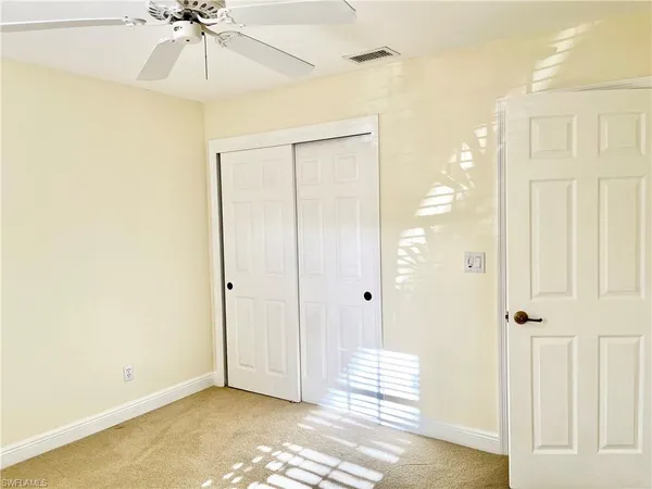 a floor to ceiling window and wooden floor