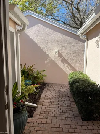 a balcony with table and chairs